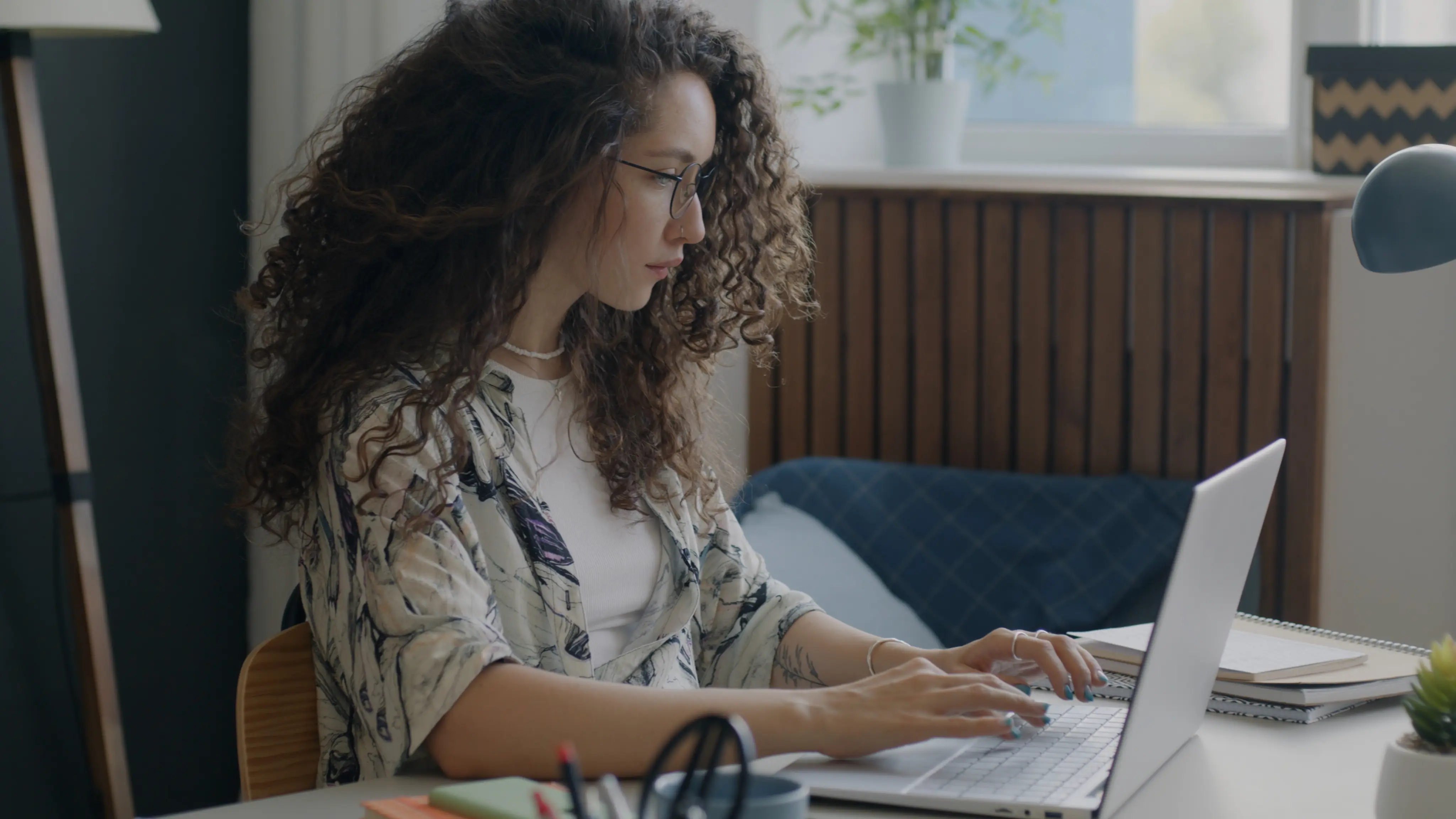 Developer working on custom platform development using laptop, focusing on scalable SaaS systems and automation