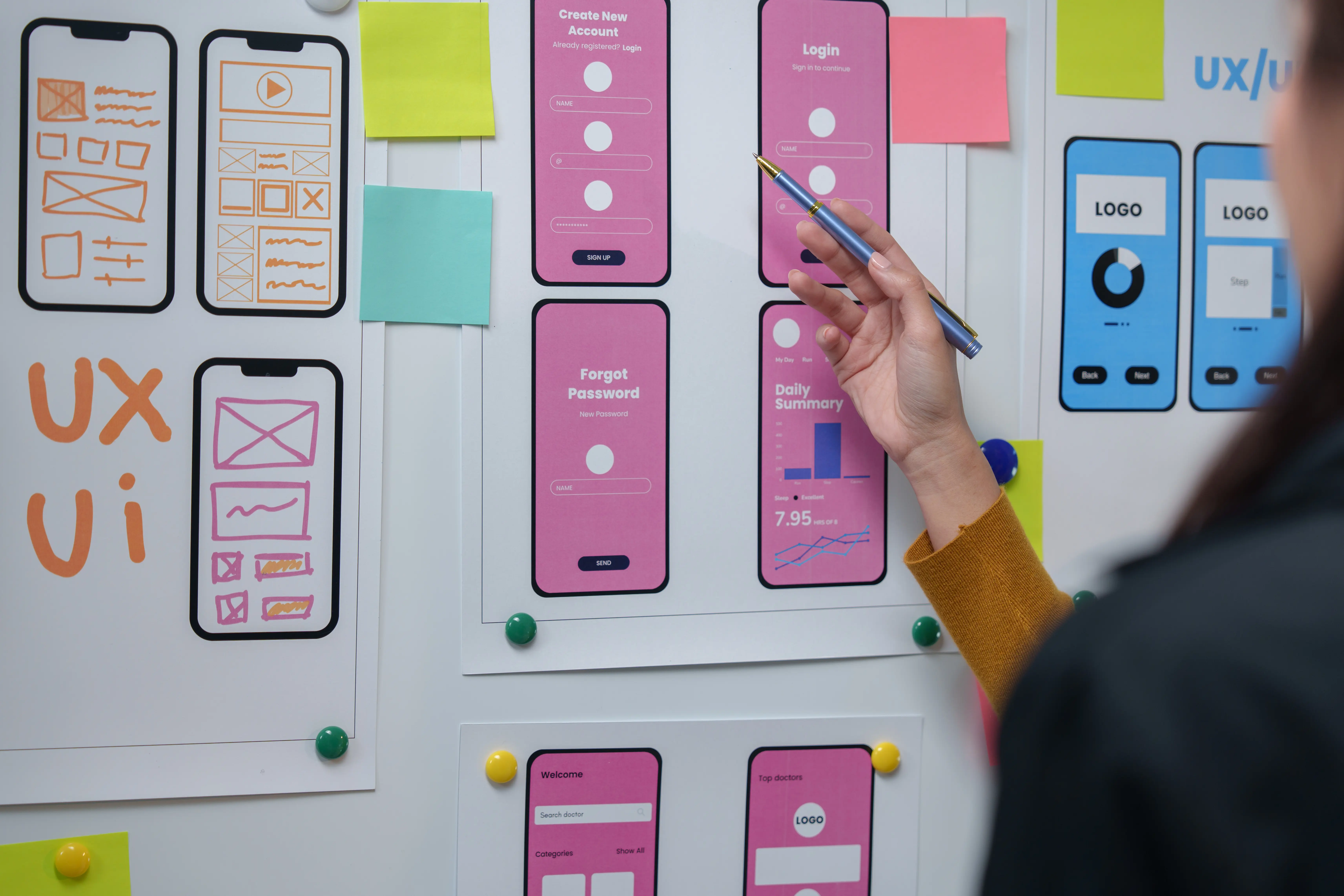 UX UI design agency in Vancouver-A web designer reviewing website and mobile application layouts at a workstation, analyzing interface designs and improving user experience workflows.